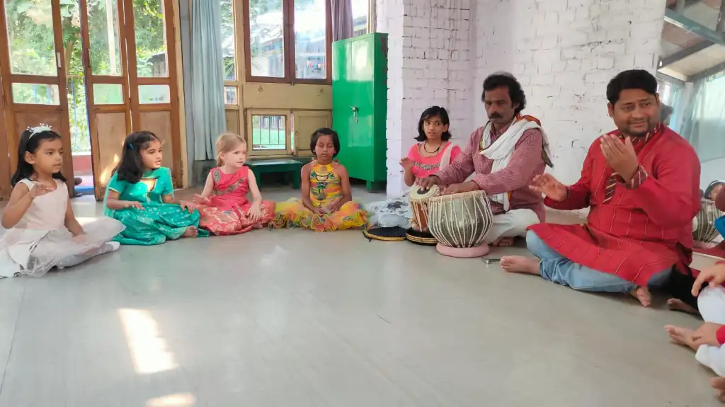 children-playing-drums-with-teachers